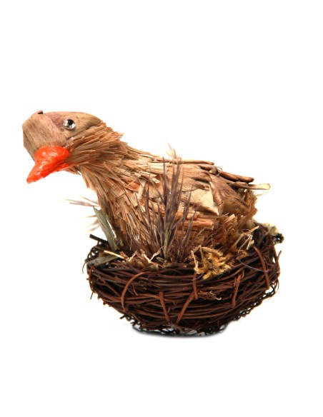 Duck in wood and bark nest